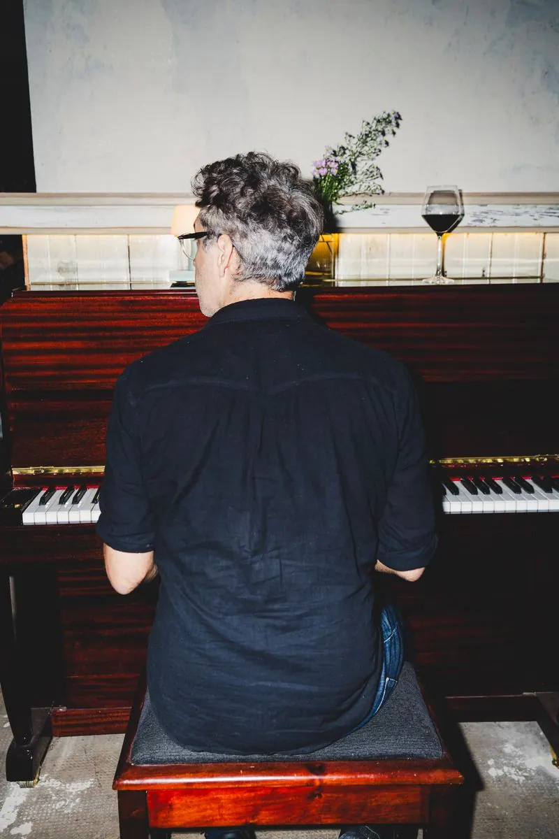 Pianist playing the hall piano at Soler Vino Pizza, Villa Crespo
